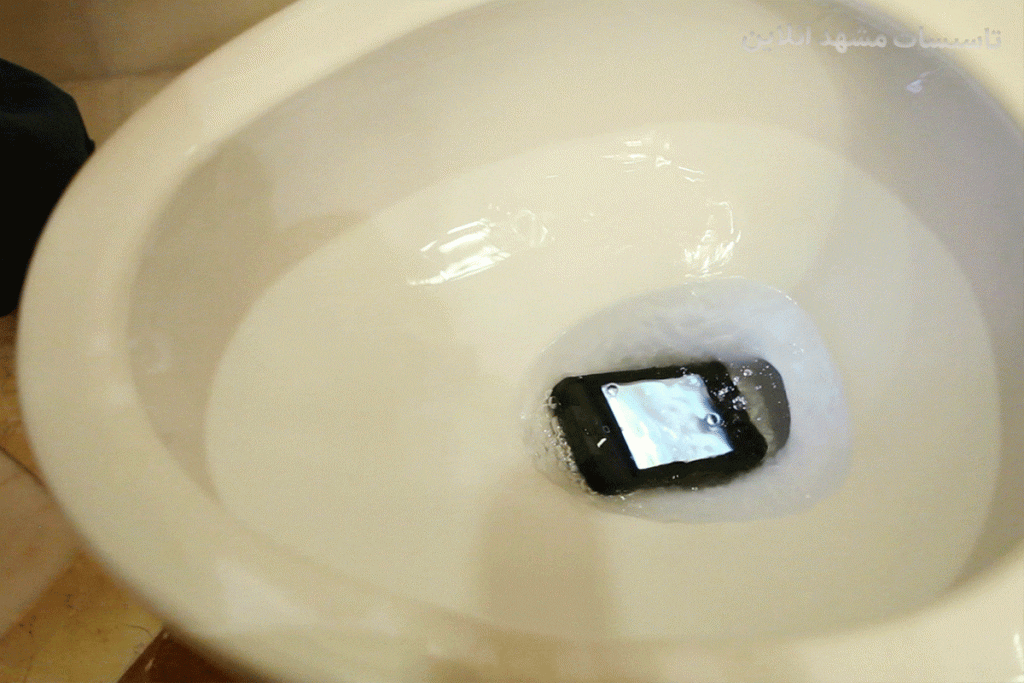 درآوردن گوشی از چاه دستشویی